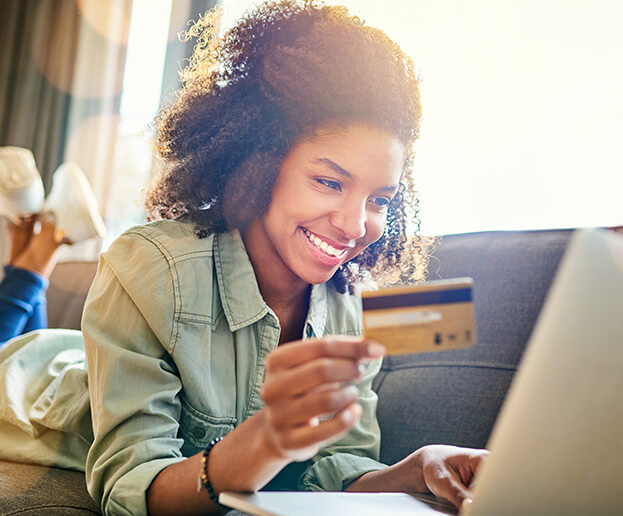 young woman paying bills online