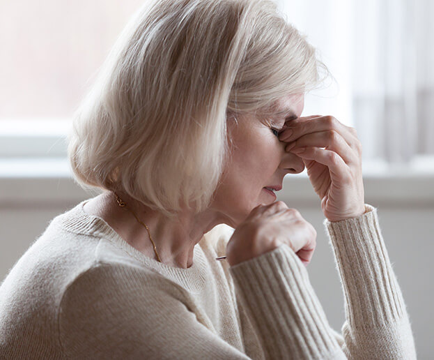 woman experiencing a headache